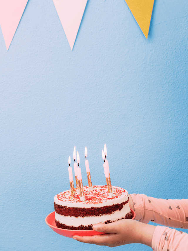 Girl's Hands Holding A Birthday Cake Stock