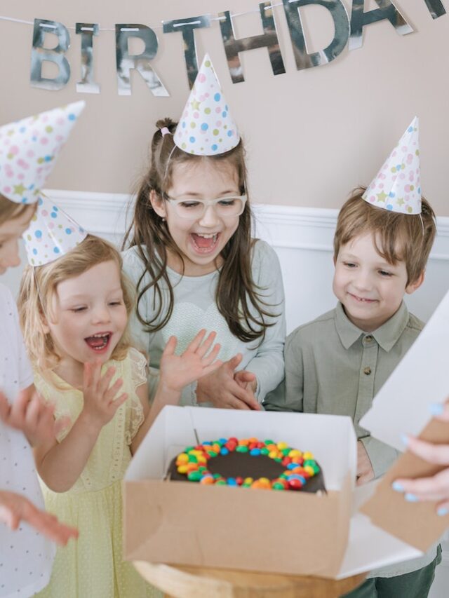 Happy Kids In Front of A Birthday Cake Stock