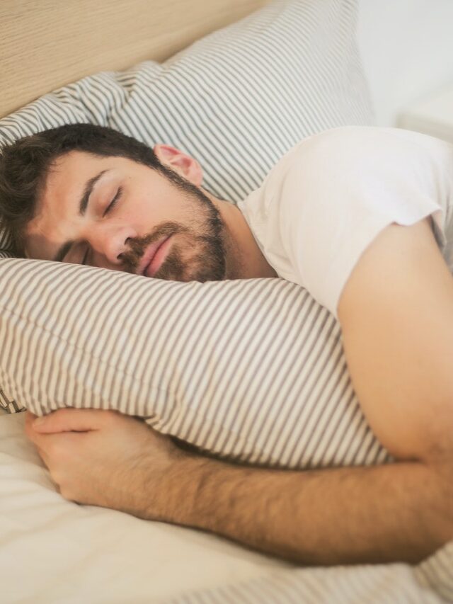 Man Sleeping On The Bed Stock