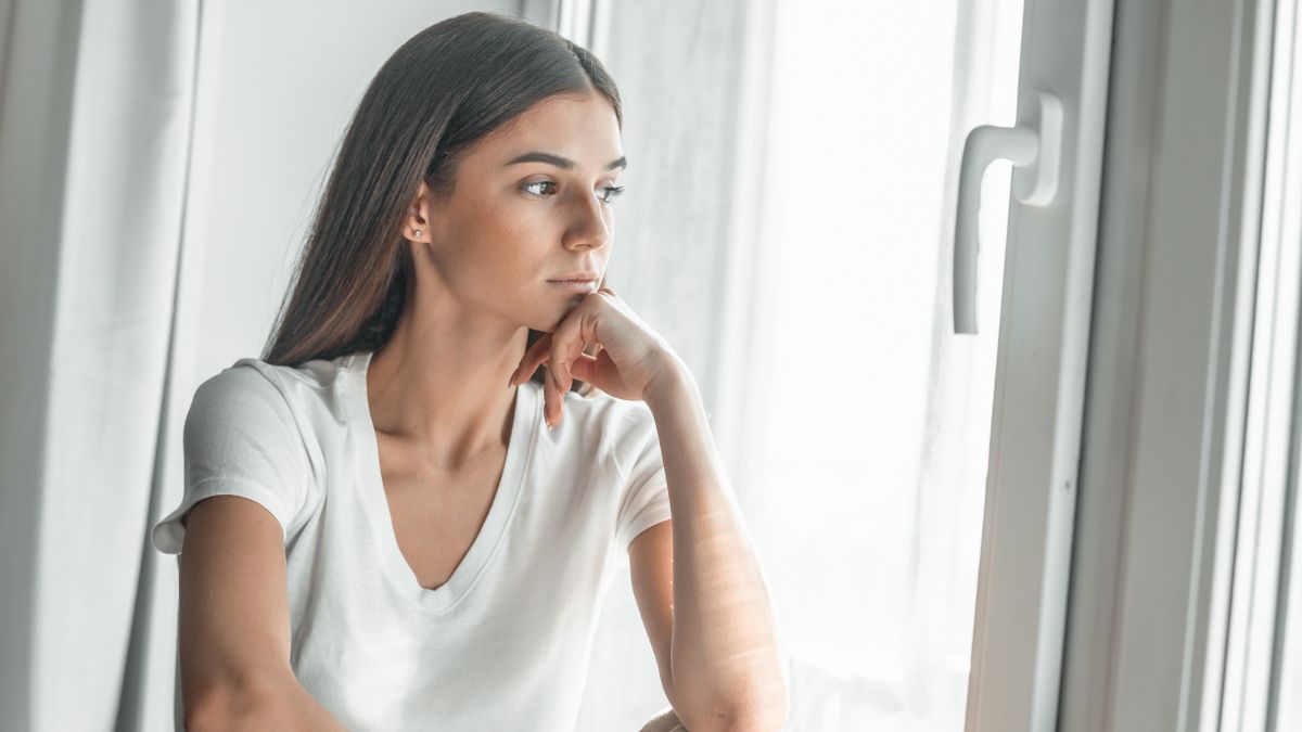 Sad Woman Looking By The Window MSN