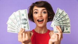Short Haired Woman Happy Holding Money MSN