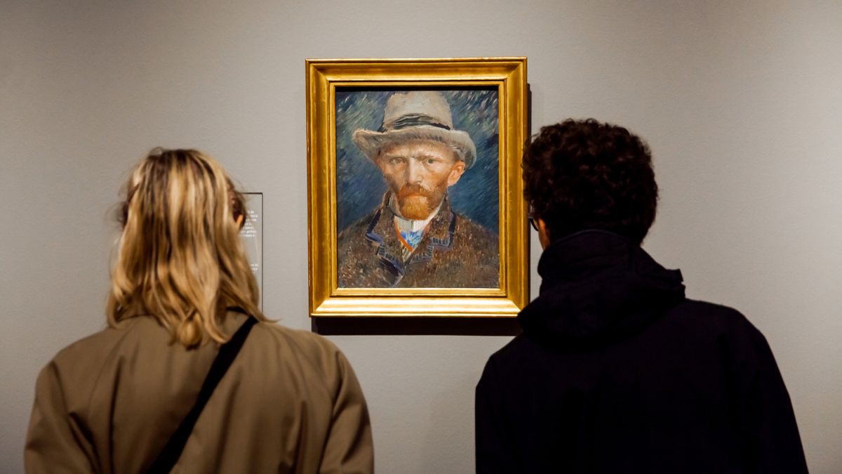 Two People Looking At Vincent Van Gogh Self Portrait In The Museum