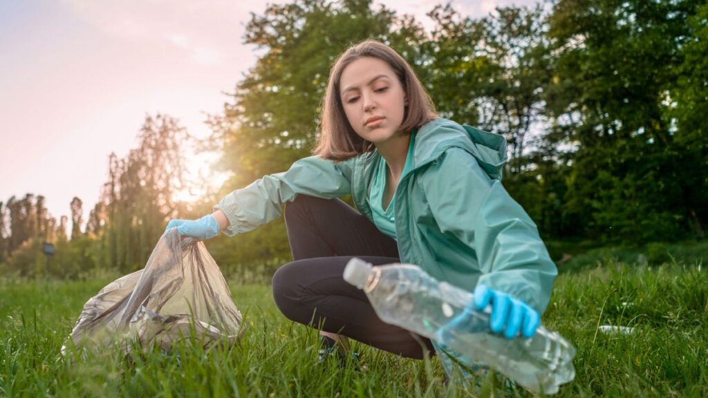 Woman Collecting Plastic Bottle Outside Cleaning Litter Trash