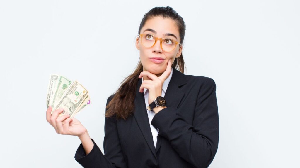 Woman Holding Money Thinking