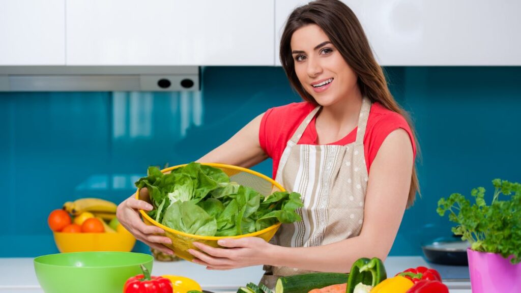 Woman Carrying Vegetables Preparing Meal Planning In The Kitchen