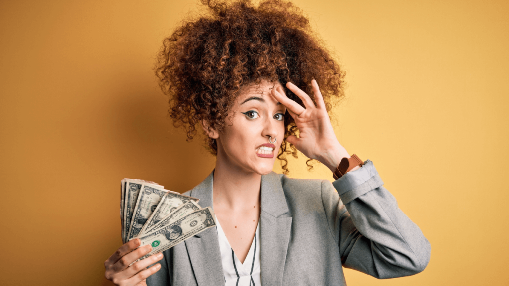 Woman Holding Money Cash Looking Stressed MSN