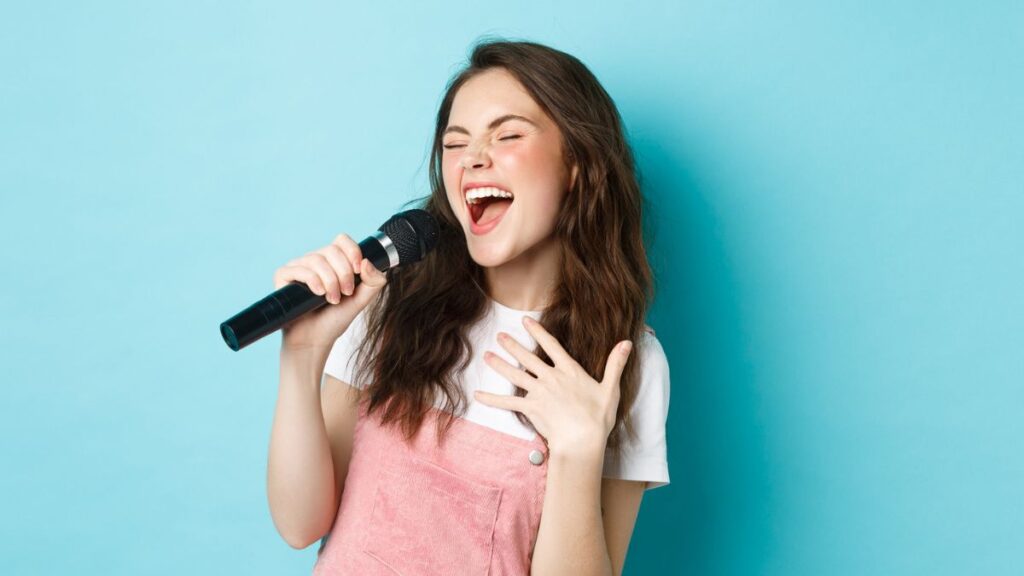 Woman Singing Using A Microphone