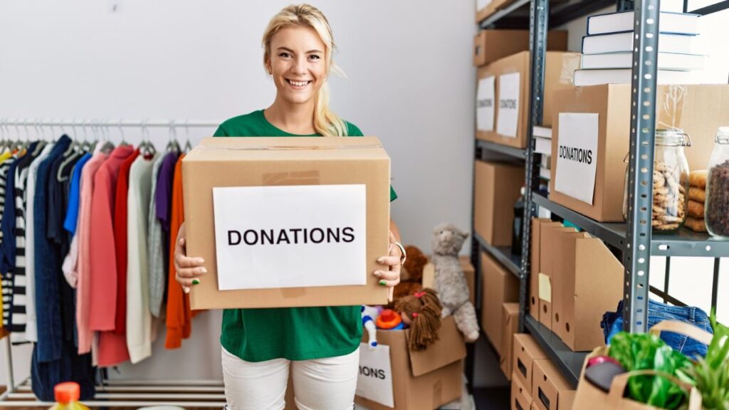 Woman Carrying A Box For Donation