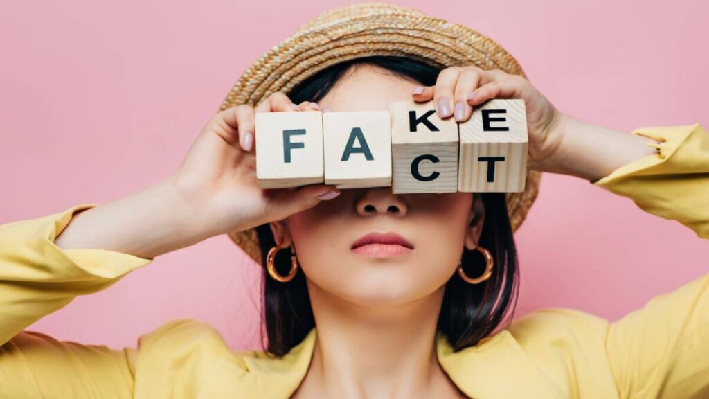 Woman Holding Wooden Cubes Fake Fact Lettering MSN