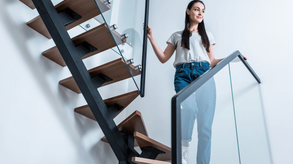 Woman Standing on Stairs in Home MSN