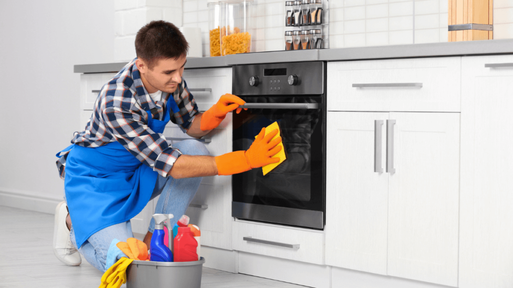 Man Cleaning the Kitchen Oven Doing Chores MSN