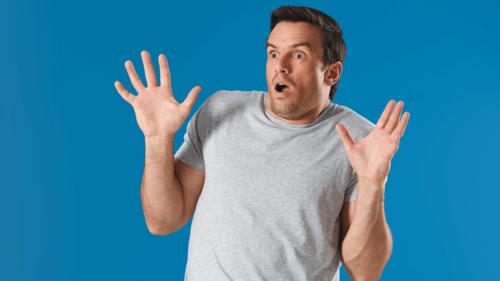 Man Looking Scared and Shocked, Hands Up MSN