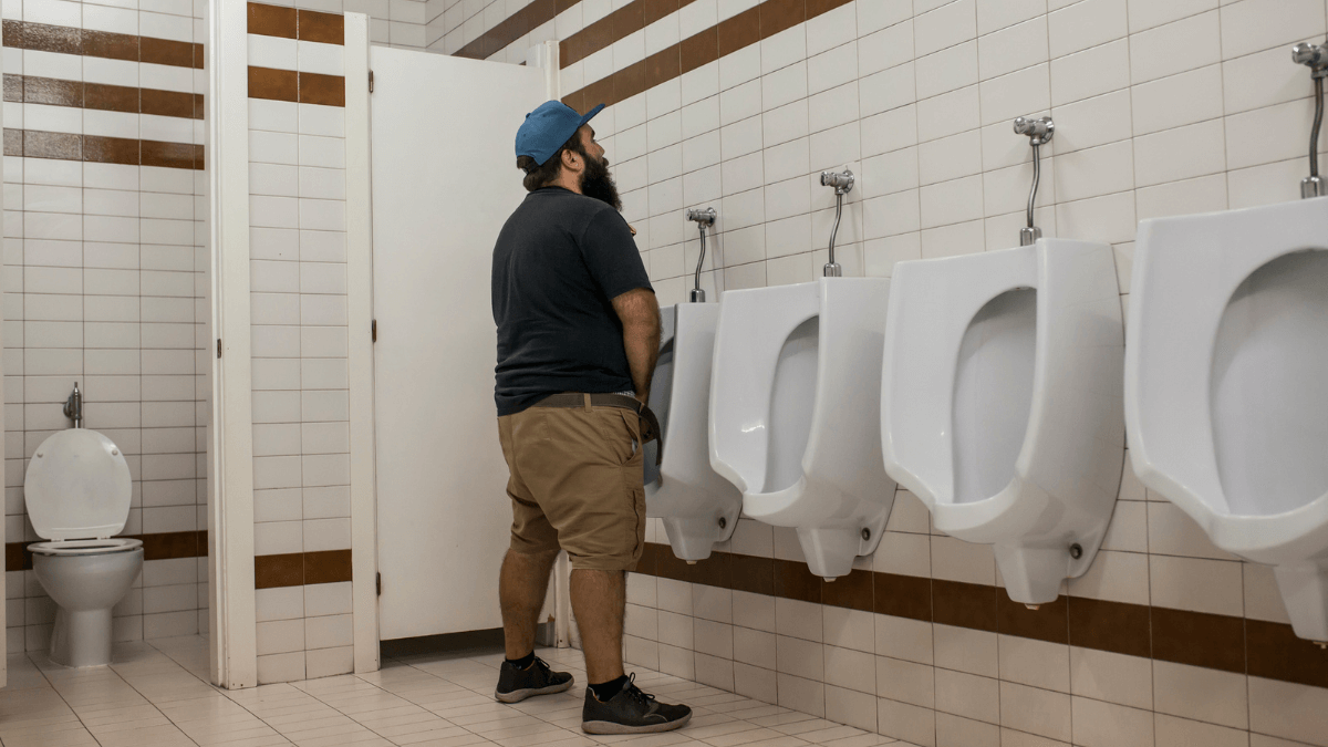 Man Using Urinal Toilet MSN