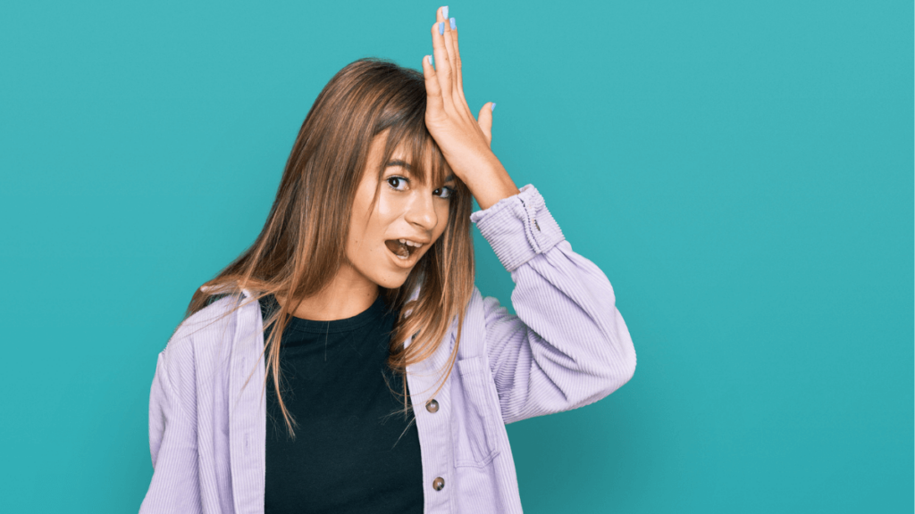 Woman Facepalm Holding Hand to Head Signing Stupid or Dumb MSN
