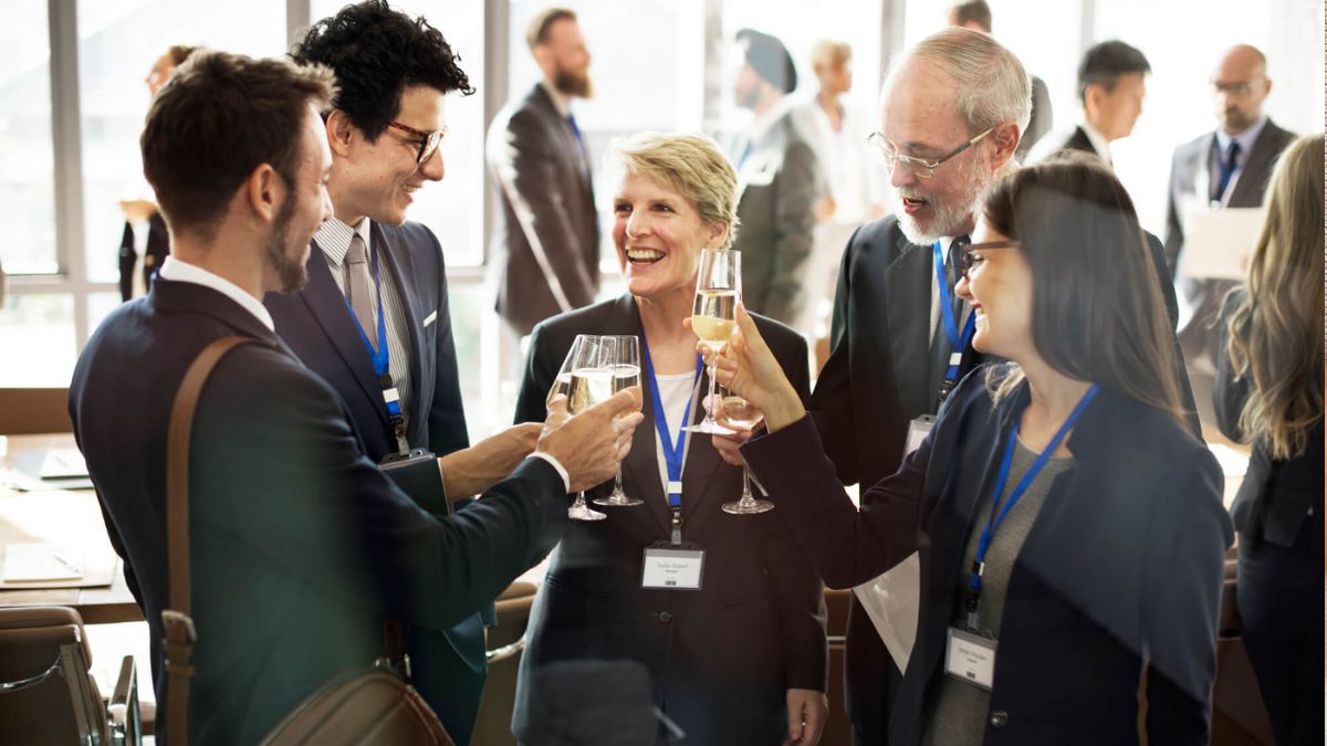 Business Team In Meeting Holding Wine Glasses MSN