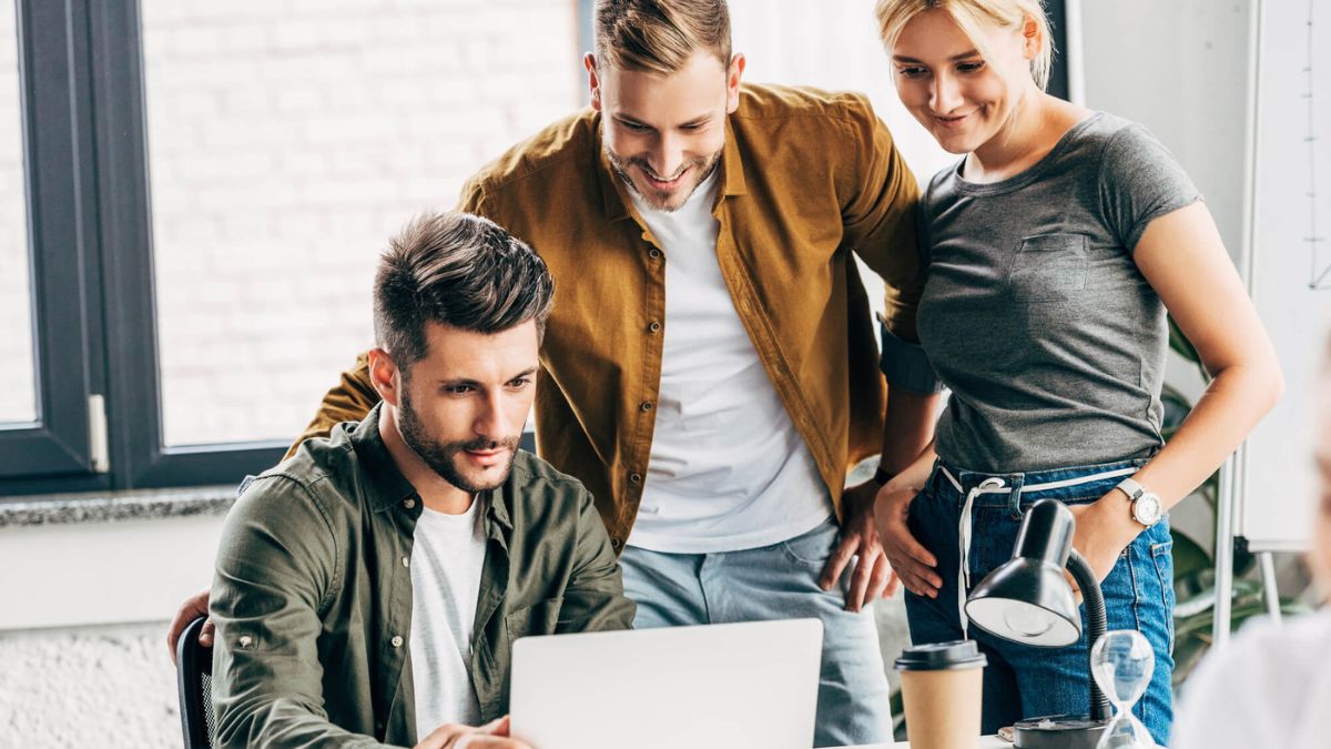 Group Of Young Managers Working Together With Laptop At Office MSN