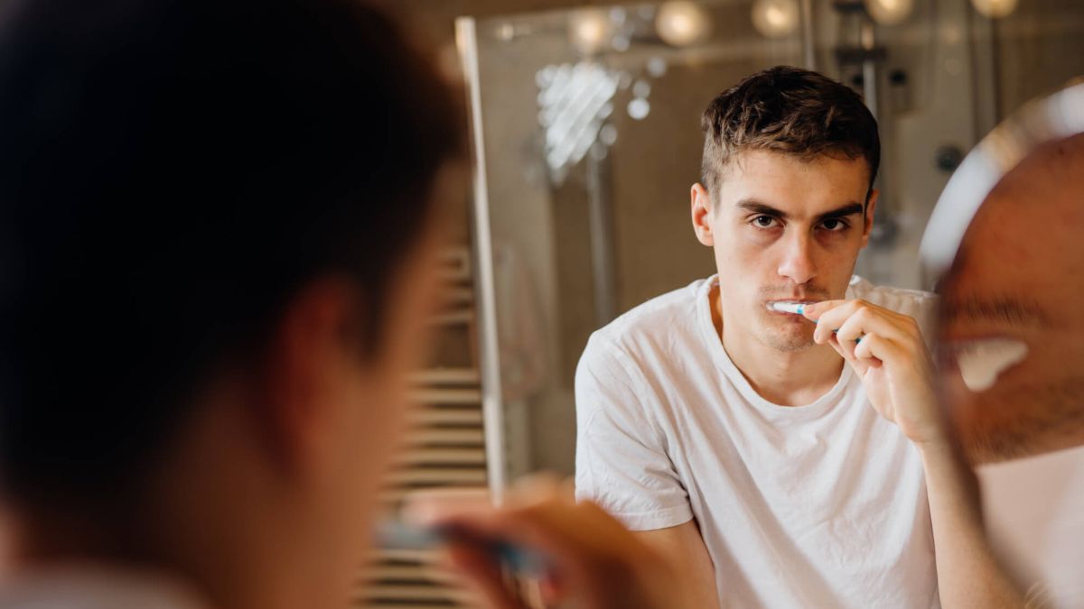 Man Brushing Teeth Looking Bored MSN