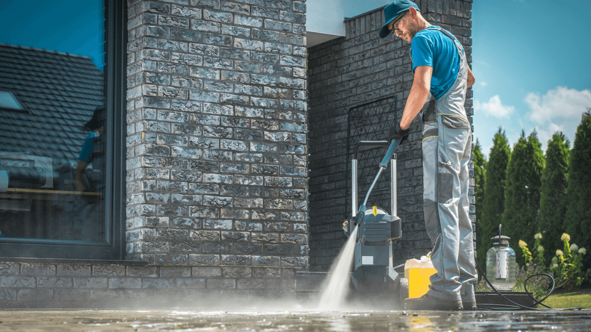 Man Cleaning House Patio Garden with Pressure Washer MSN