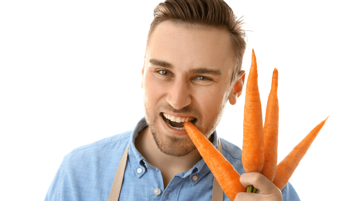 Man Eating Healthy on Carrot Smiling MSN