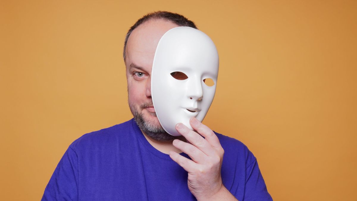 Man Taking Off Mask Revealing Face MSN