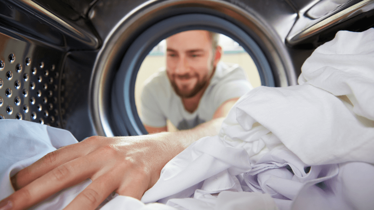 Man Unloading Washing Machine Doing the Laundry MSN