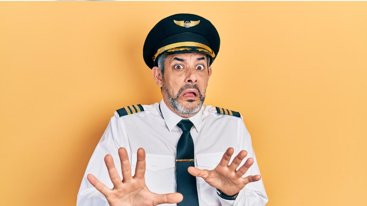 Middle Aged Man In Pilot Uniform Looking Scared MSN