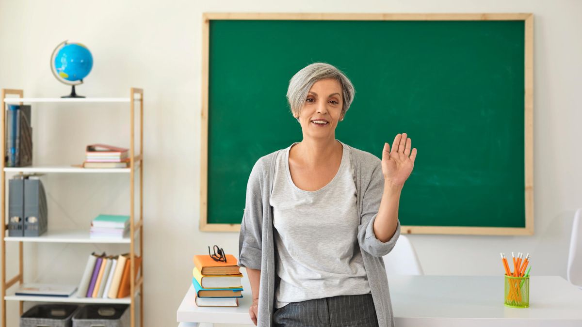 Woman With Gray Hair Teaching In Classroom MSN