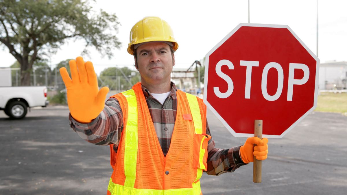 Construction Working Holding Stop Sign MSN