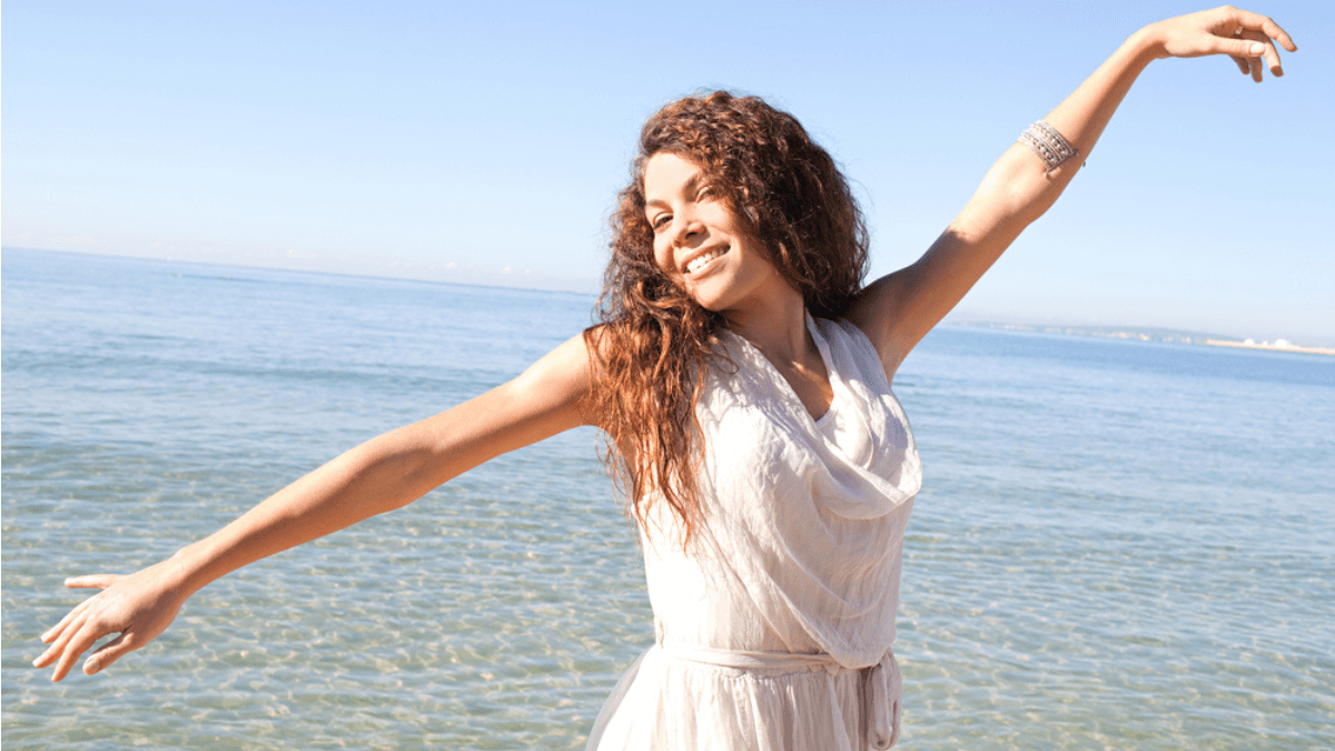 Happy woman on the beach - MSN