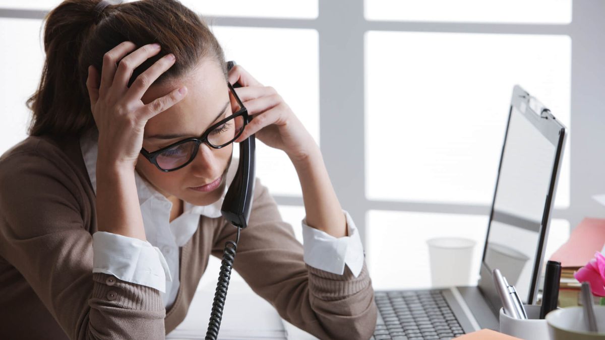 Tired Stressed Woman In Front Of Laptop At Work MSN