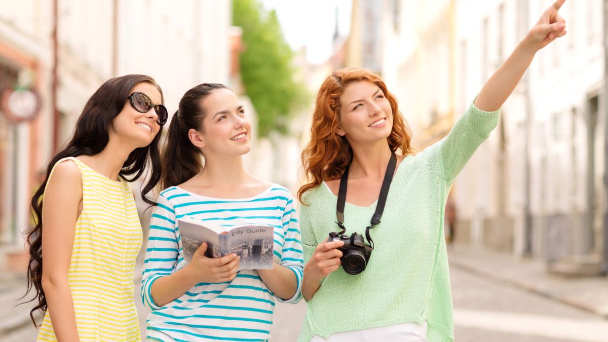 Traveling Young Women Holding Camera MSN