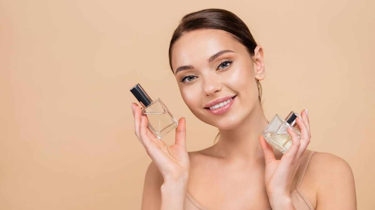 Woman Holding Perfume Bottles MSN