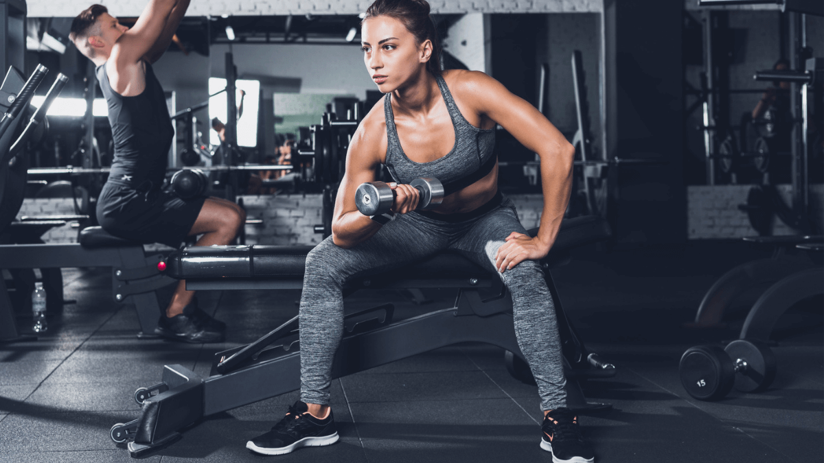 Woman Working Out In Gym Doing Sport and Lifting Weights MSN