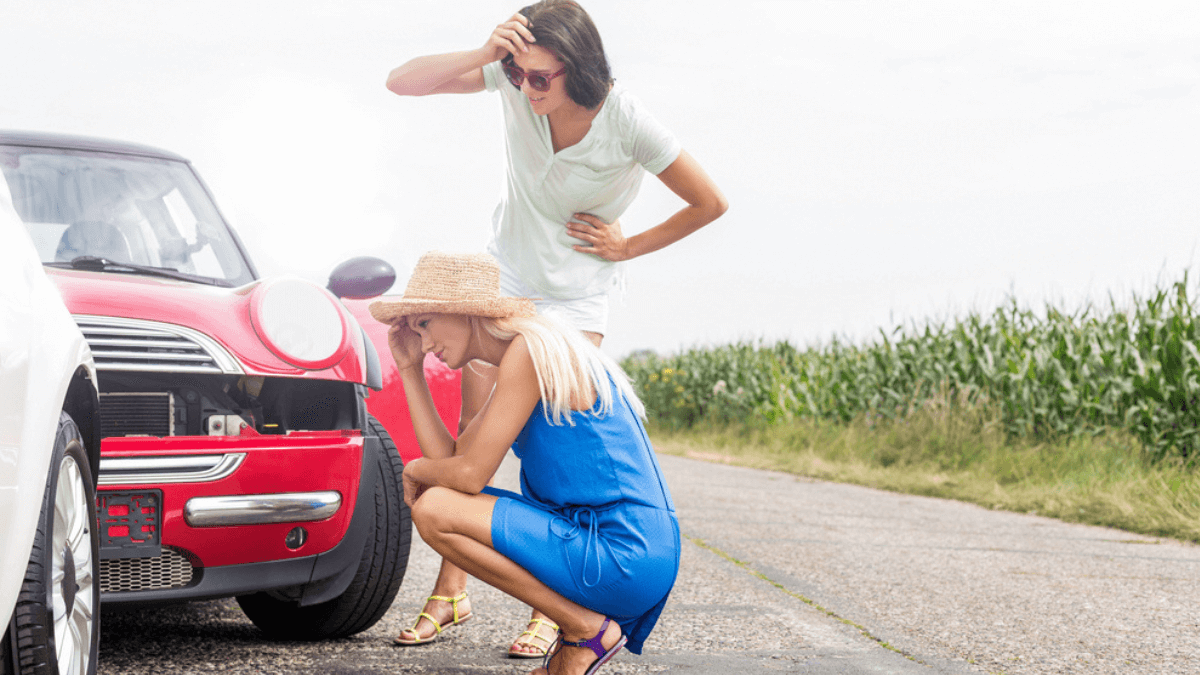 Women looking at damaged cars - MSN