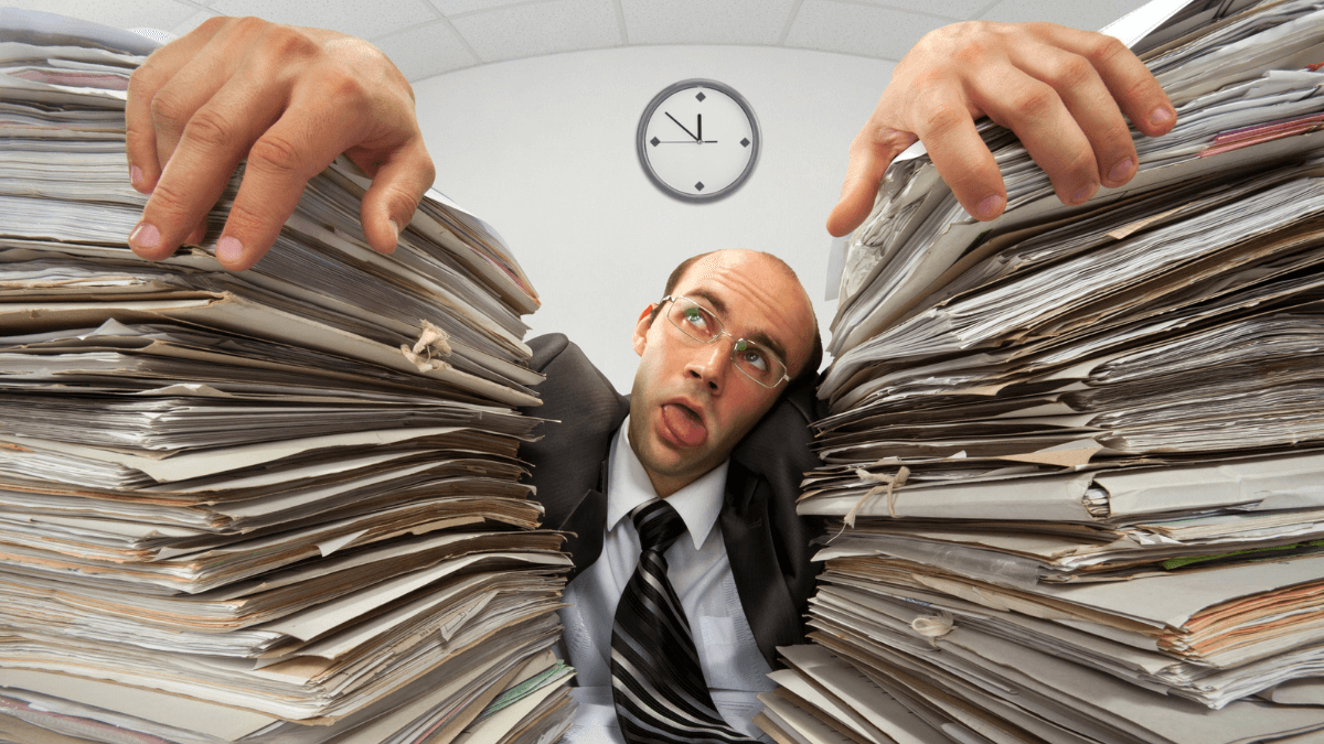 Man-Stressed-Tired-Paperwork-Documents-MSN