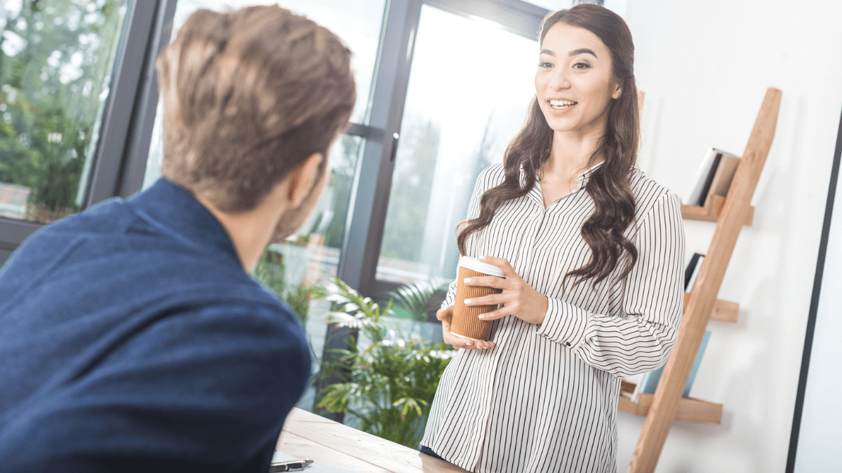 Businesswoman talking with colleague