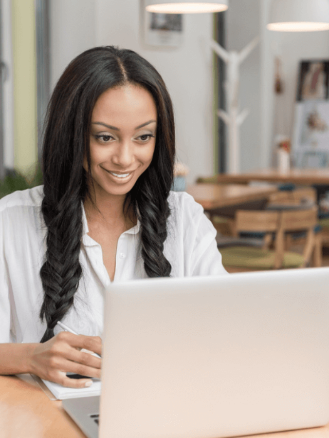 Businesswoman with laptop at cafe