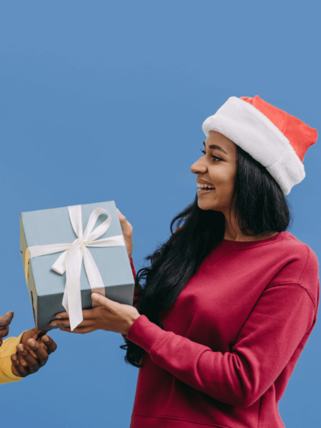 Woman Giving Gift Shocked Stock