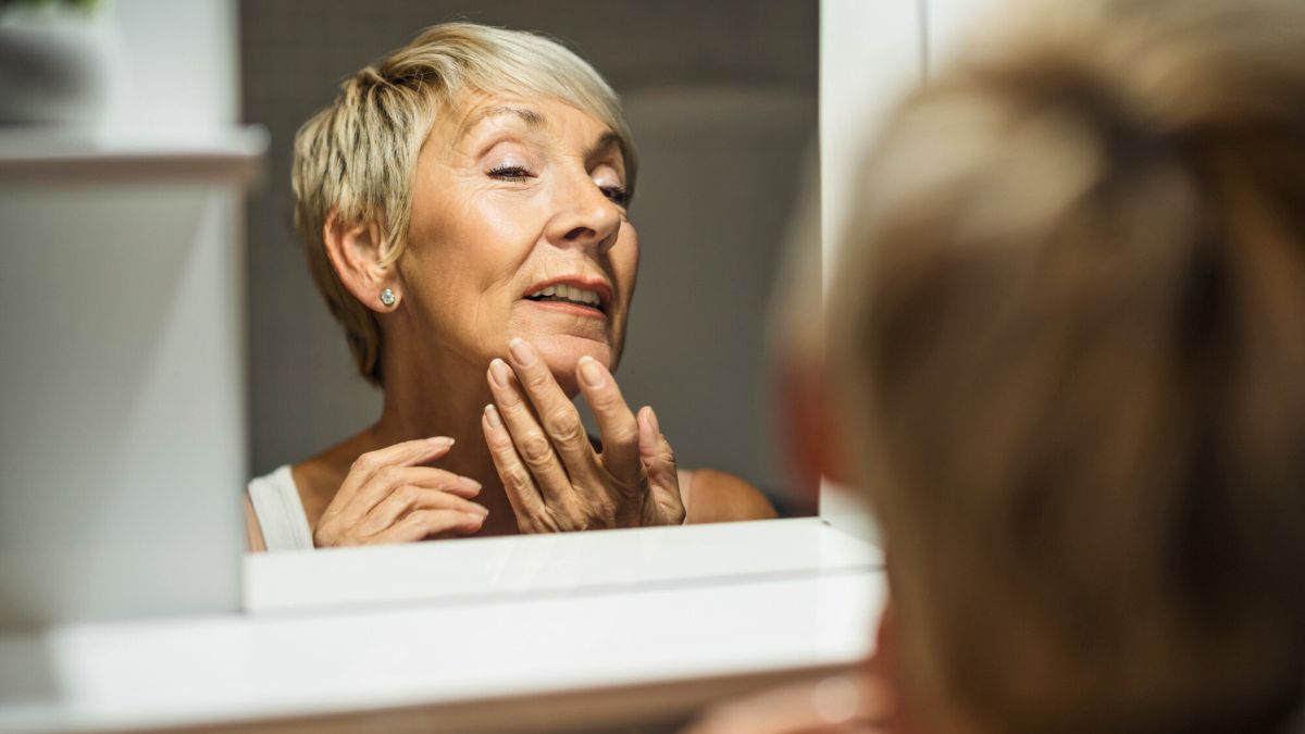 Mature Woman Looking at the Mirror MSN