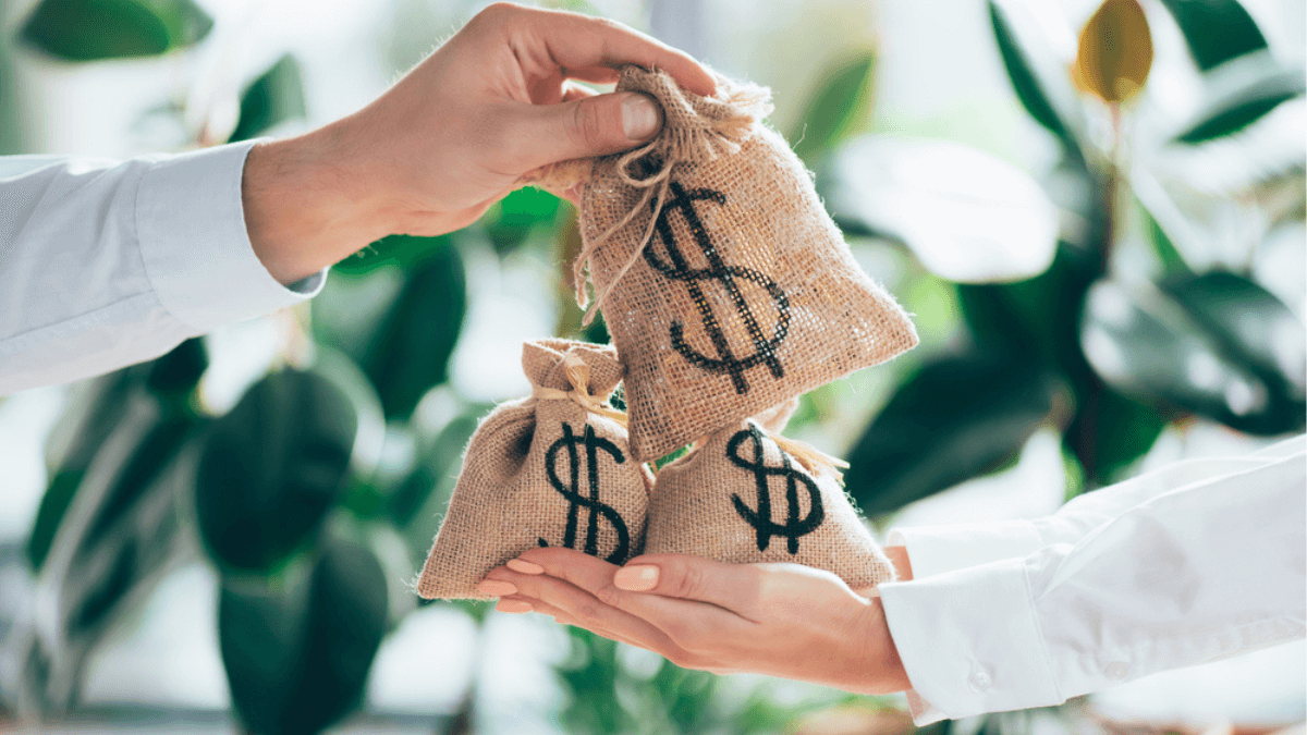 People holding sackcloth bag with dollar sign