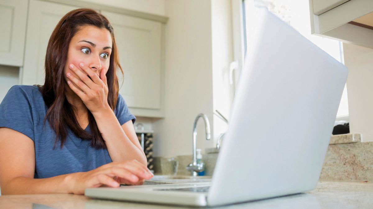 Surprised Woman Looking at Her Laptop MSN