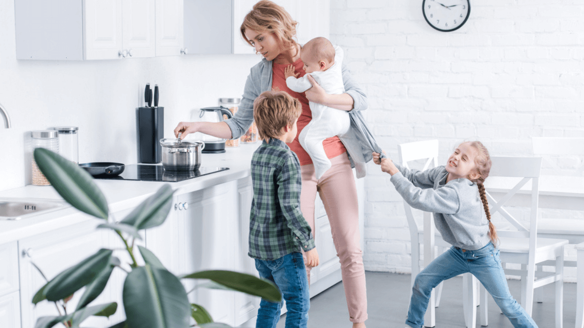 Tired mother taking care of three kids MSN