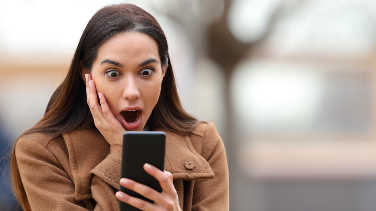 Very Very Shocked Woman MSN staring at phone