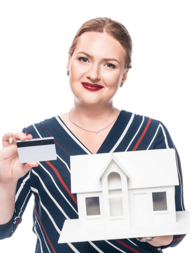 Happy female estate agent showing maquette of new house