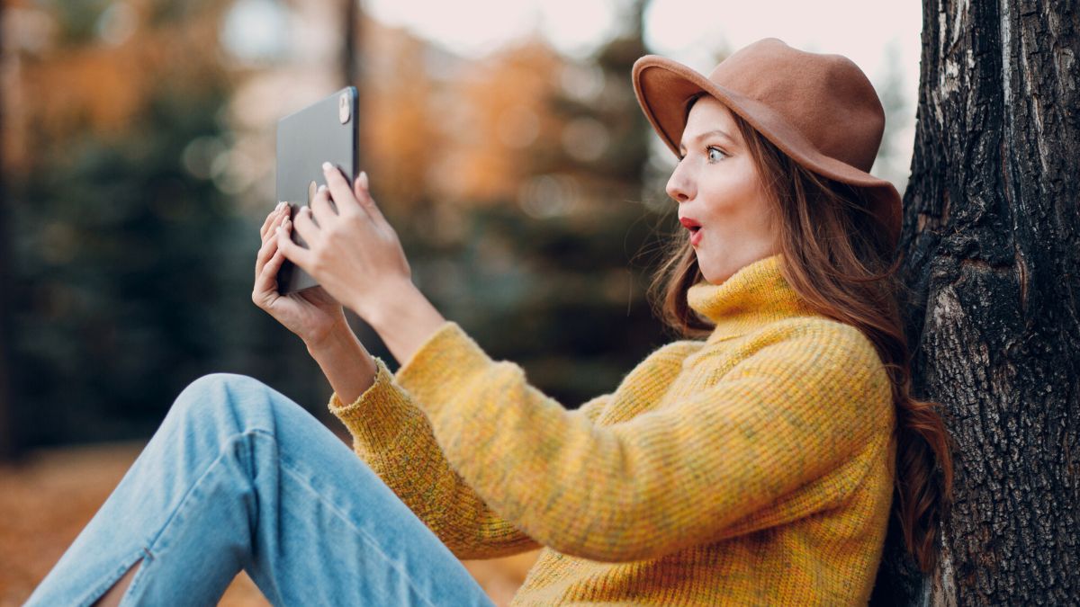 Surprised Woman Sitting By a Tree MSN