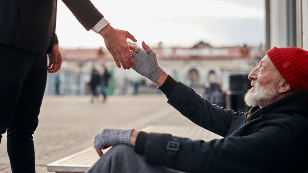 Man helping out an older man to get up MSN