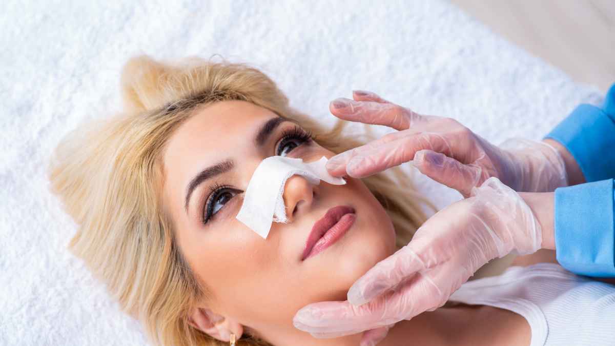 A woman receiving a nasal procedure from a doctor MSN.