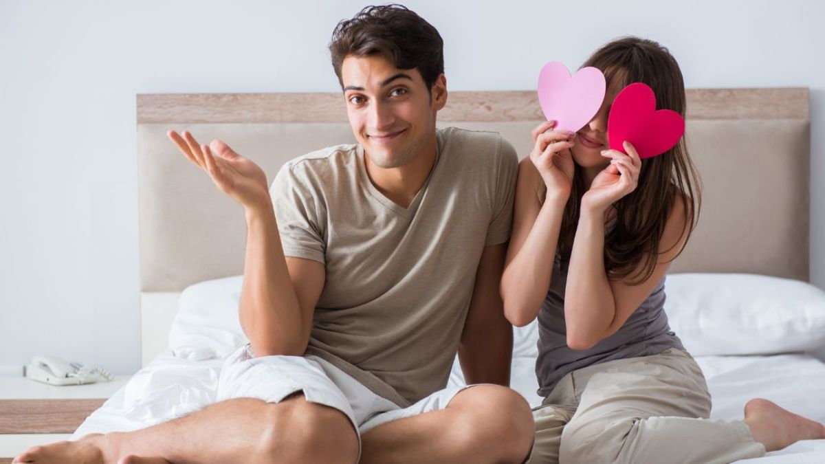Sweet couple posing in bed MSN