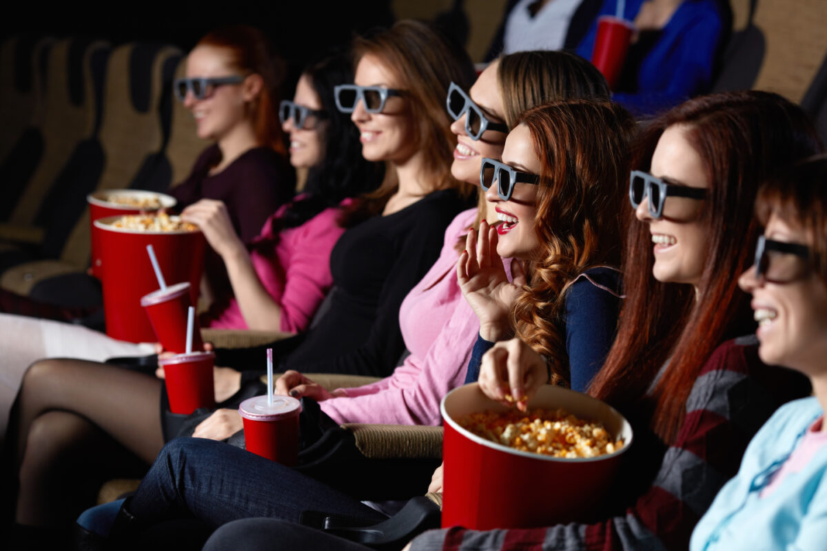 Smiling young people in the cinema