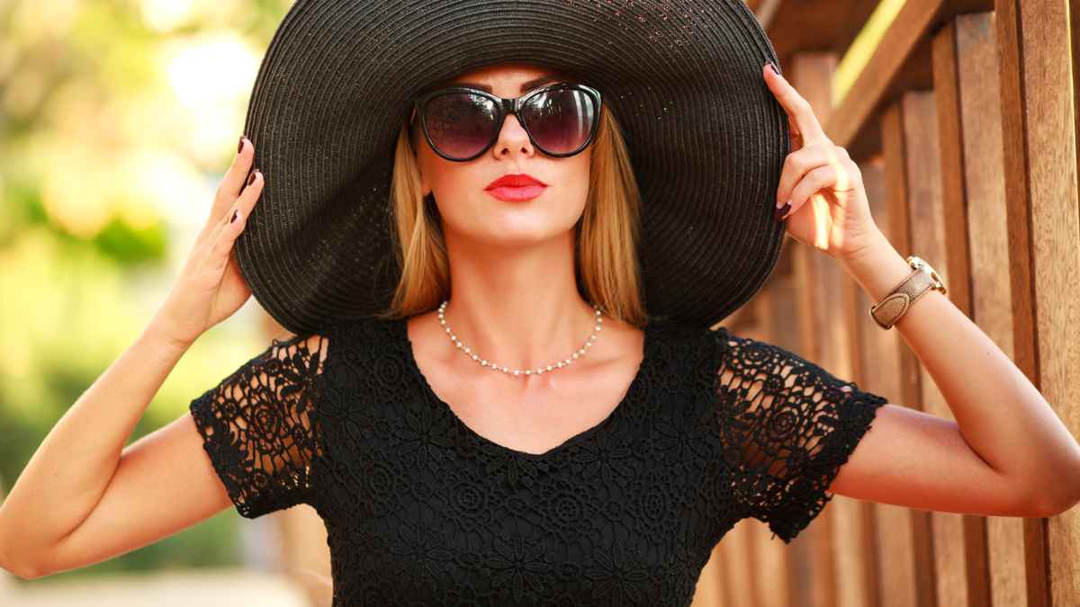 Woman using shades and big hat black MSN